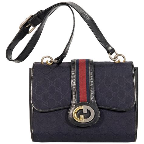 vintage navy blue gucci handbag|gucci suede shoulder bag.